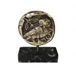 Owl, Relief representation, made of brass and placed on a greek black marble base, with white and grey waters.