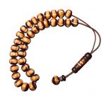 Worry bead, made of carved camel bone stones, with a fine wooden finish