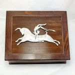 Bull Leaping, Silver-plated copper mounted on handmade wooden box.