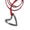 Twisted Heart, Pendant, Silver 925°, hanging on a red suede cord.